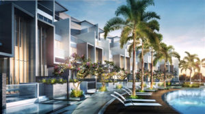 New and modern condominiums overlook a clean pool and palm trees